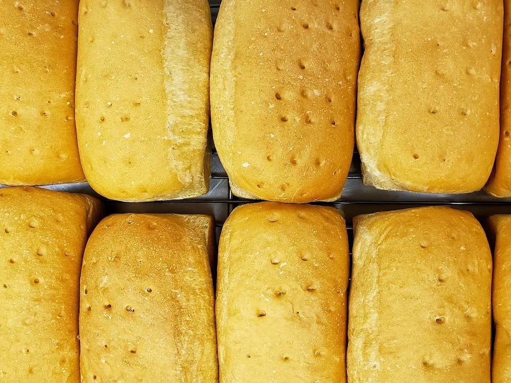 Trays of fresh-baked bread loaves