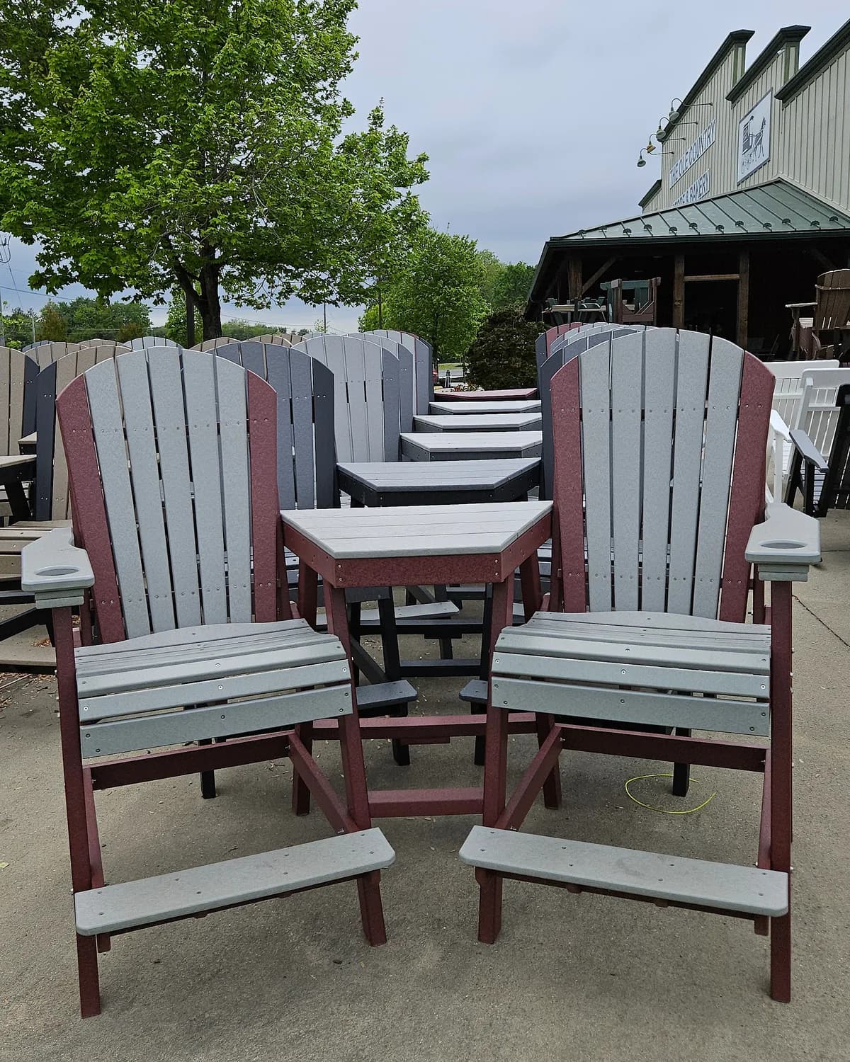 Poly outdoor chairs and a side table outside the store
