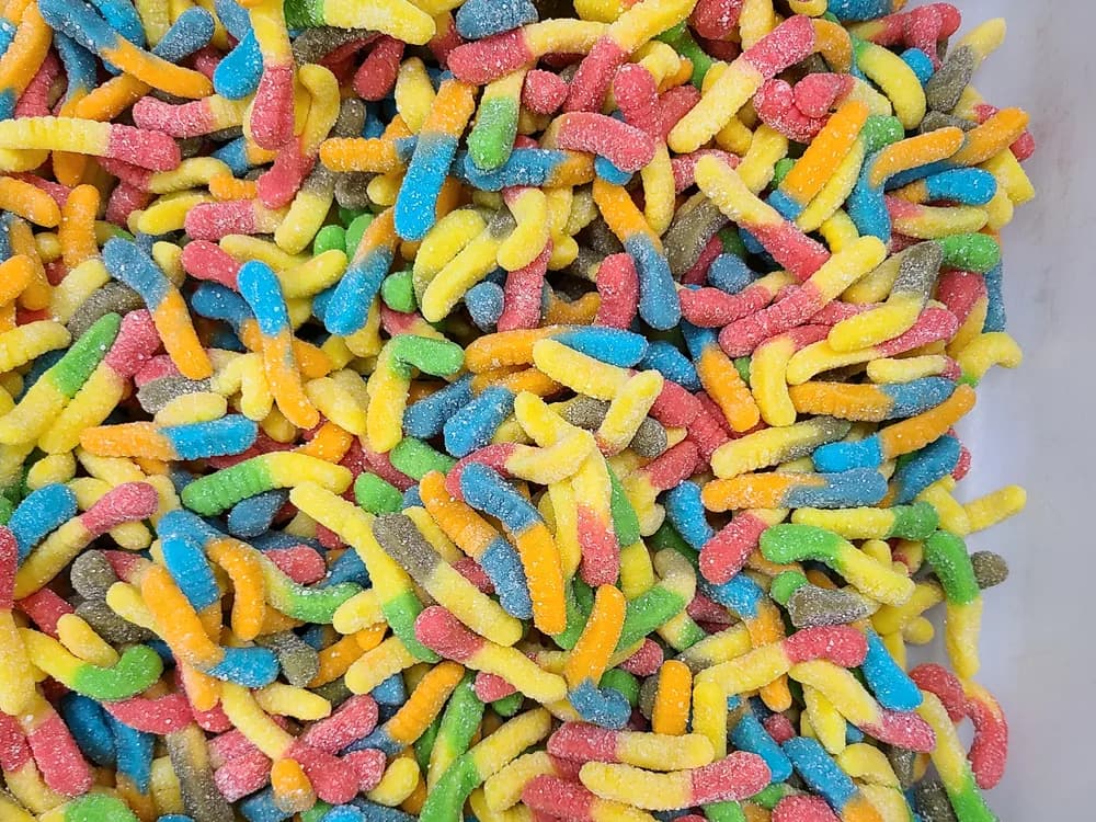 A bin of sour gummy worms