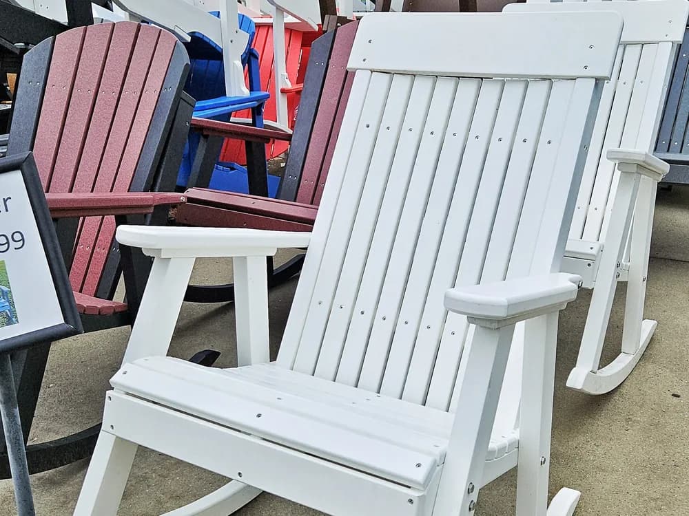 White poly rocking chairs outside the store